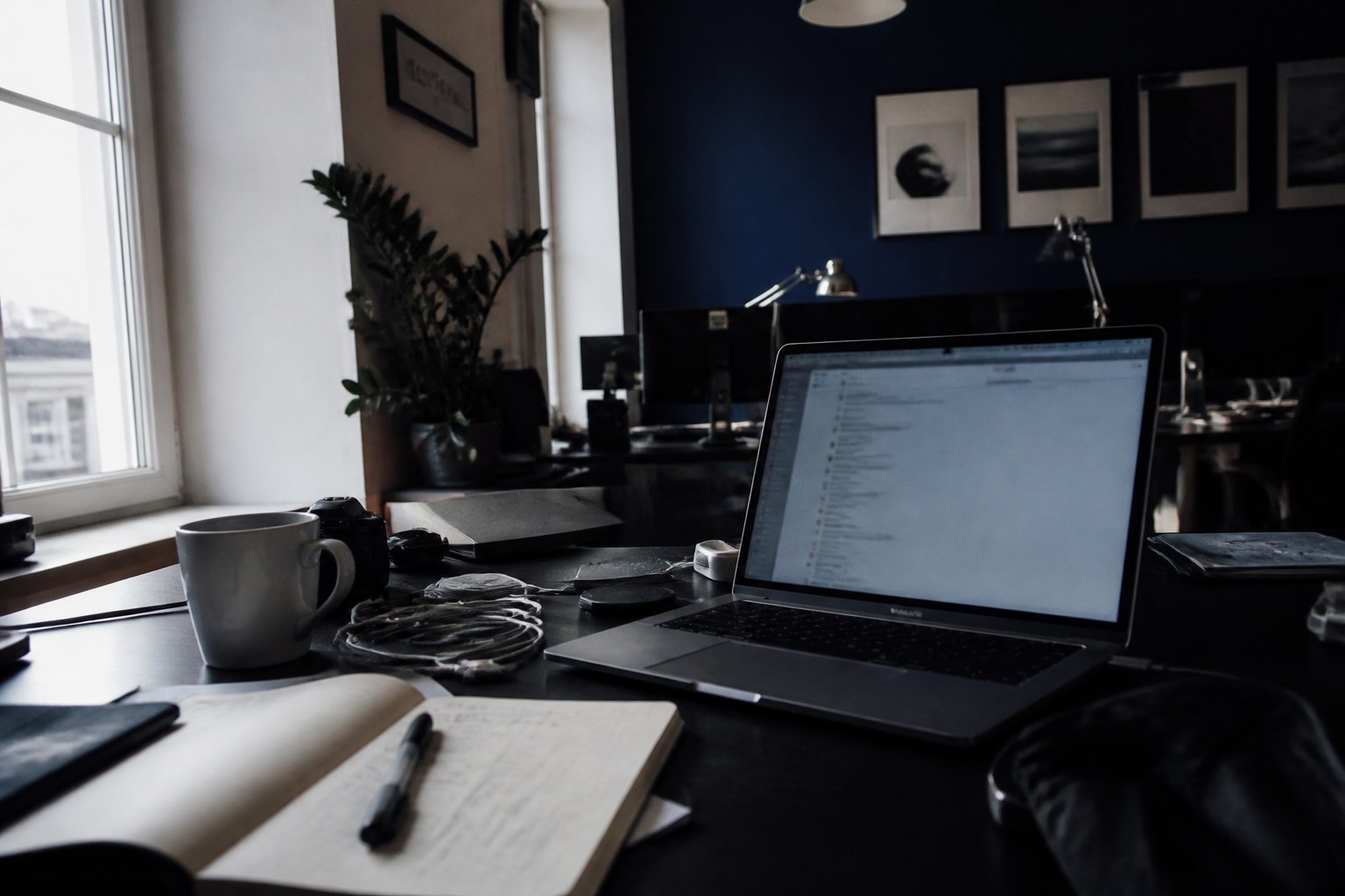Digital agency workspace with laptop and design tools
